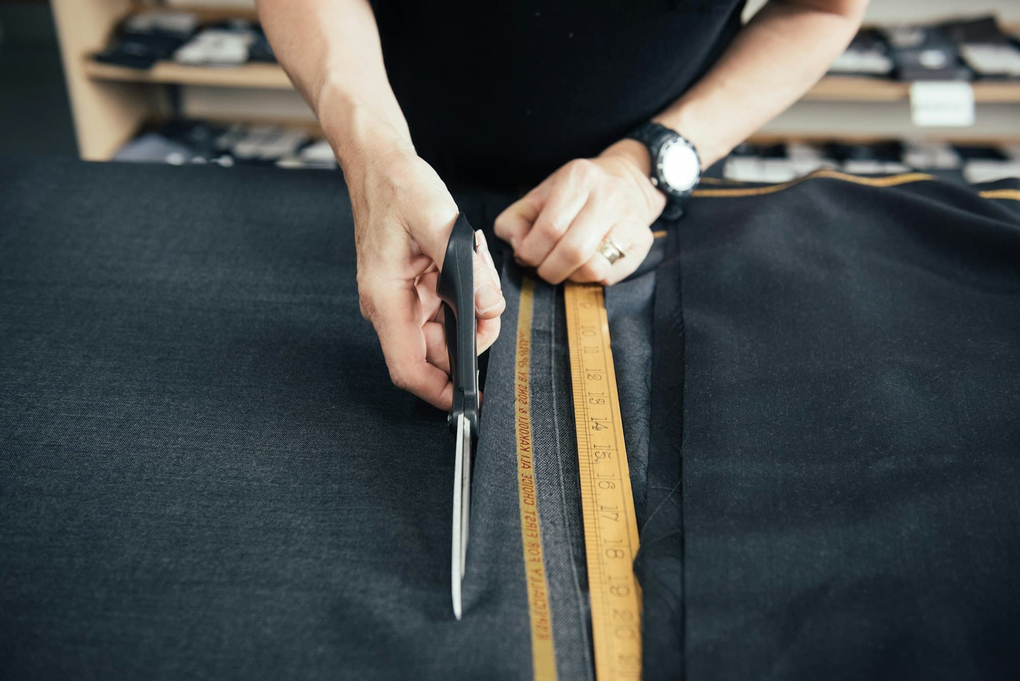 Cutting fabric along a pattern with shears